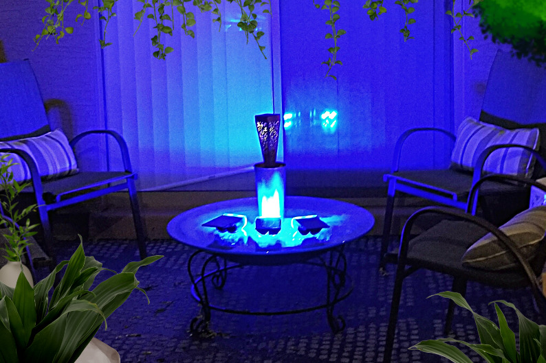 Blue solar spotlights clustered on patio table