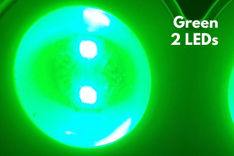 2 green LEDs turned on in solar light